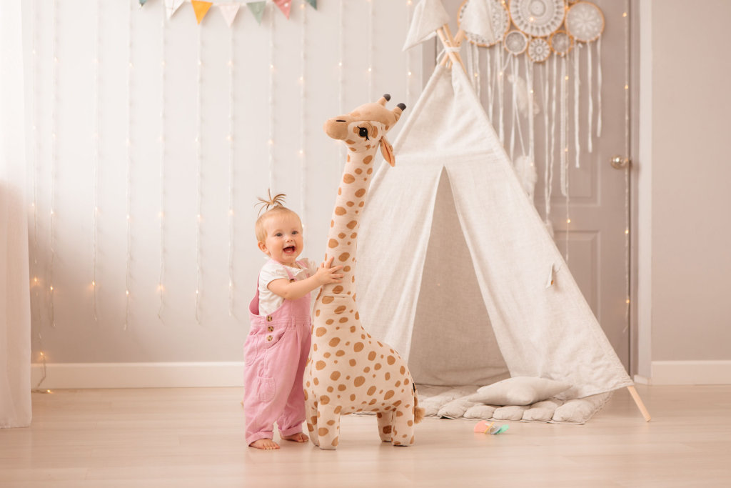 baby girl in the nursery playing,bright children's room, textiles for children's room